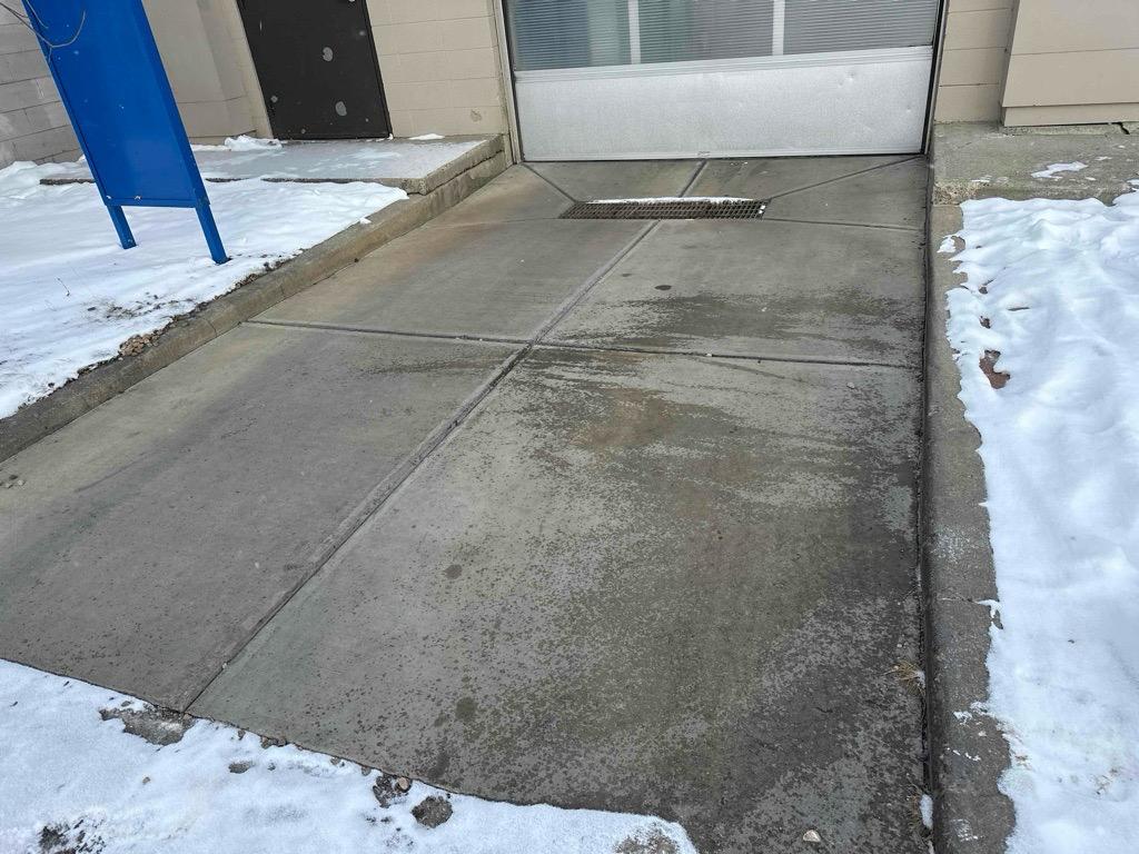Commercial parking lot with snow piled to sides in winter conditions